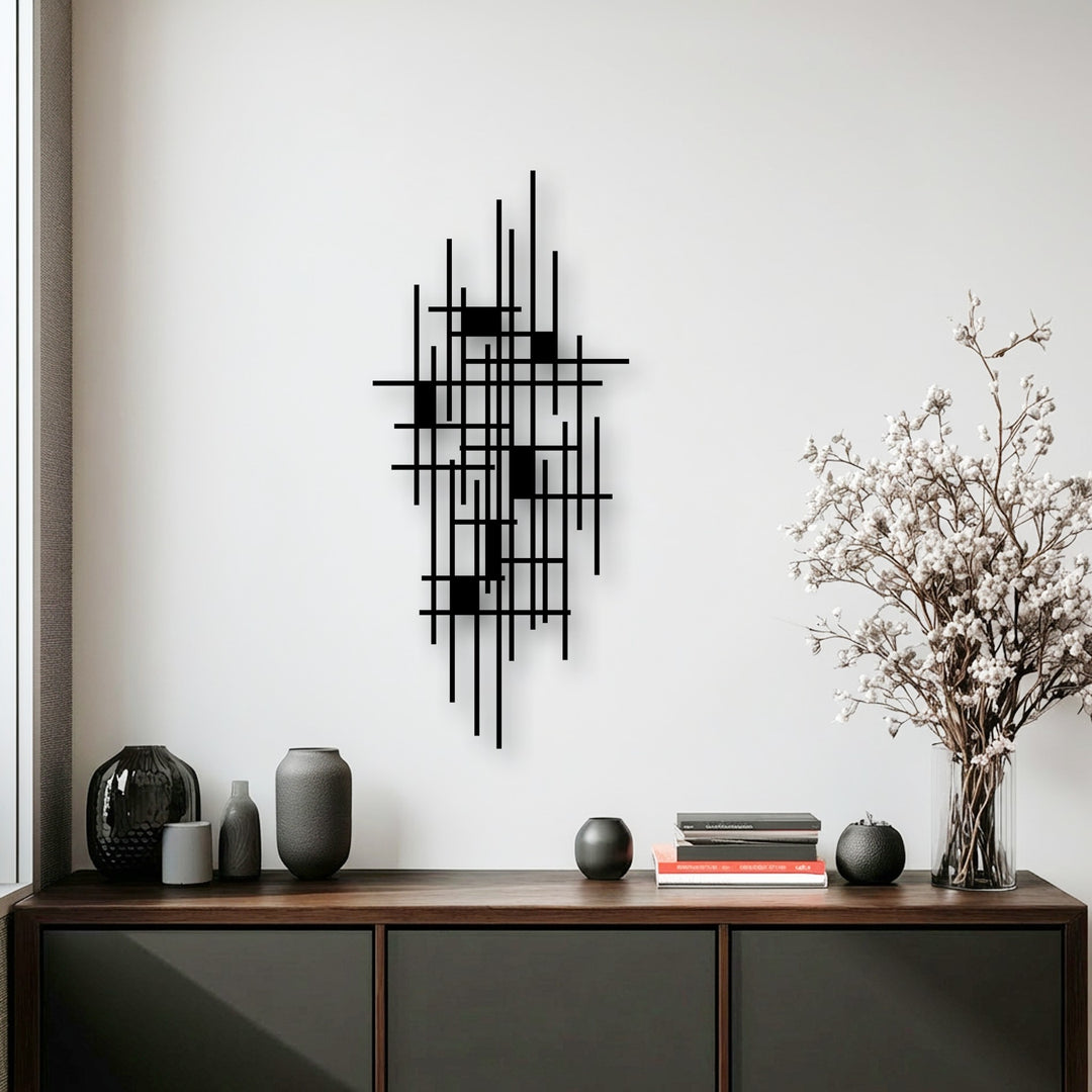 A vertically oriented, unique metal wall art piece featuring an abstract geometric grid design with interconnected lines and rectangular accents.