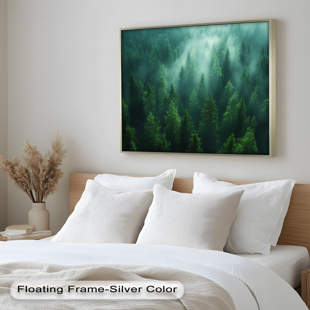 Lush green treetops emerge from the morning fog, their vibrant hues contrasting against the soft veil of mist that weaves through this breathtaking woodland landscape.