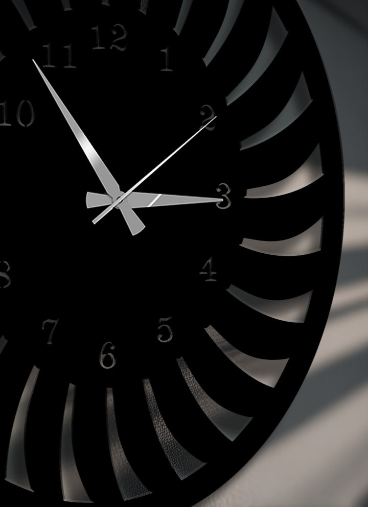 The abstract quality of this metal art for wall clock features a striking radial pattern with a modern spiral design in deep black.