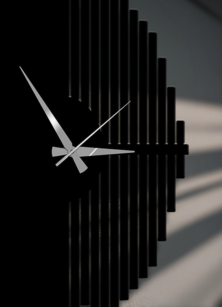 Sleek silver hands dramatically contrast against the dark face of this unique metal wall art, a modern geometric half-circle wall clock.