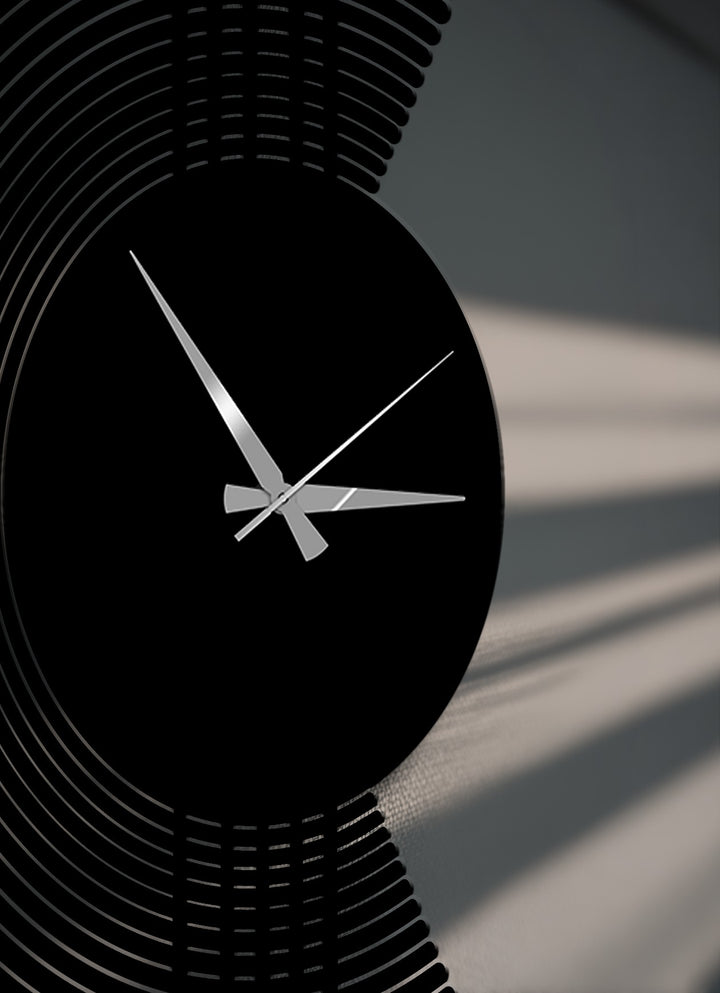 Dramatic light and shadow patterns highlight the sleek, modern arc line metal clock, a captivating decoration wall art piece.