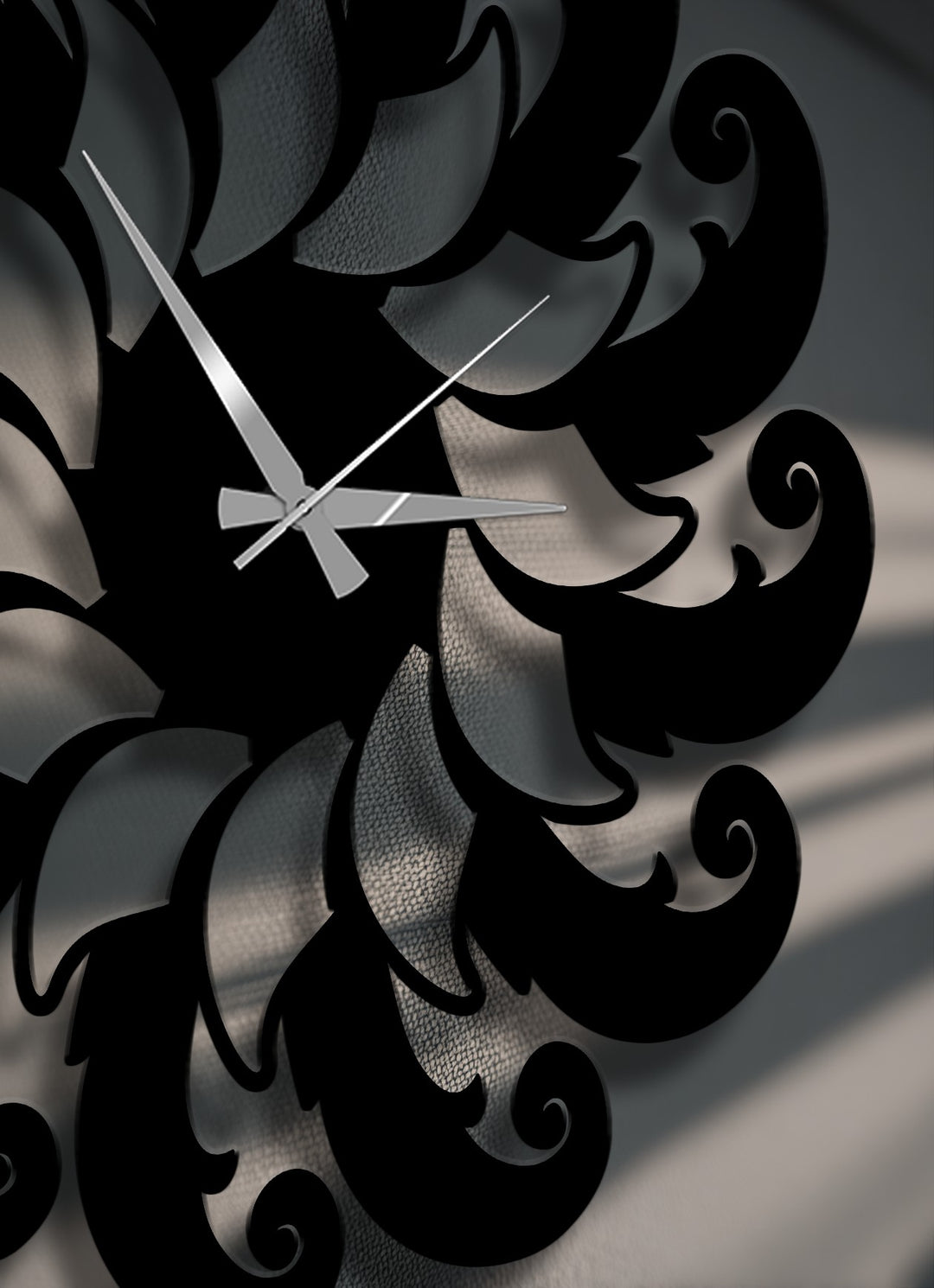 Subtle transitions between charcoal gray and deep black hues define the intricate floral spiral pattern of this unique metal wall art clock.