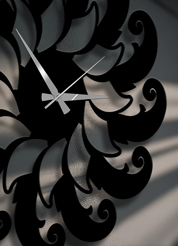 Subtle transitions between charcoal gray and deep black hues define the intricate floral spiral pattern of this unique metal wall art clock.