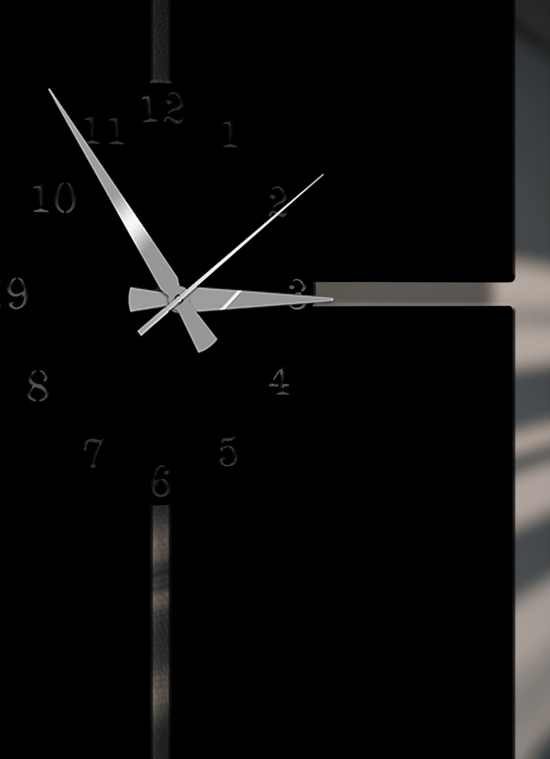 Soft reflections gently highlight the sleek silver hands and muted numbers of this modern minimal metal art for wall clock.
