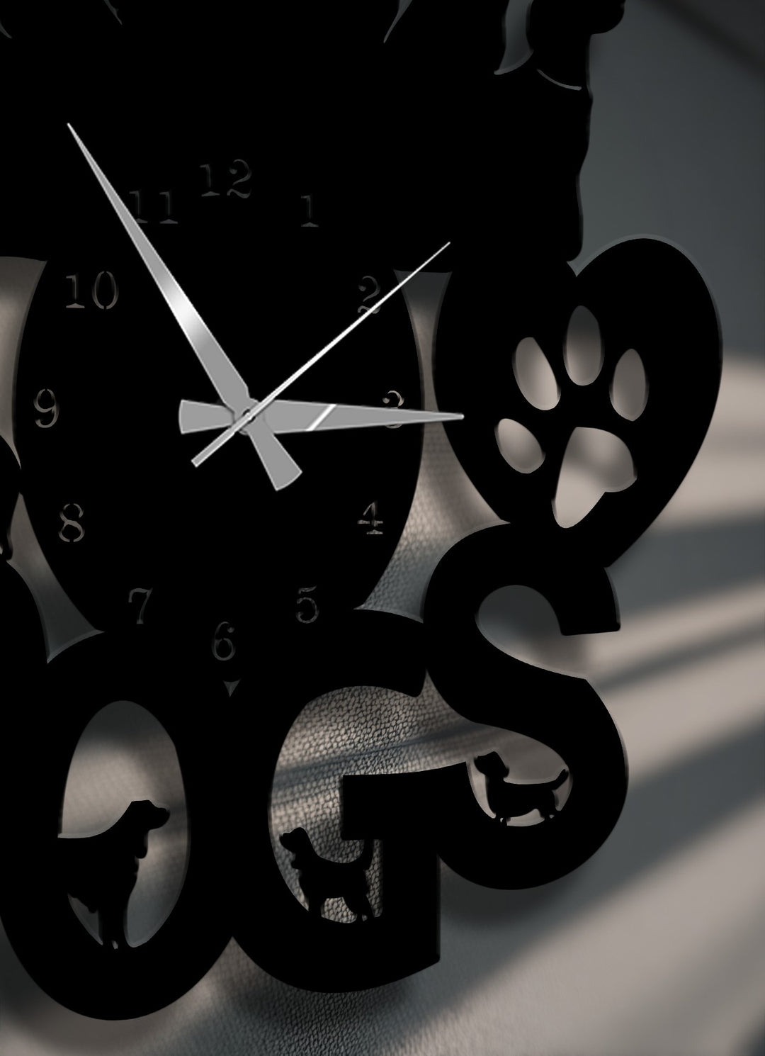 The loving mood of this sleek decorative metal art for dog lovers, a metal wall clock featuring charming dog silhouettes and a paw print heart.