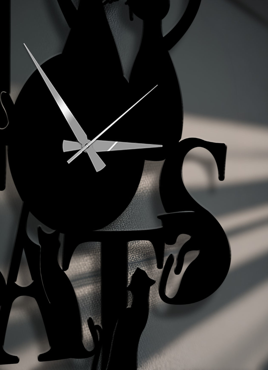 With low color saturation, this metal wall decor showcases the sleek, monochromatic Love Cats Metal Wall Clock with elegant cat silhouettes.