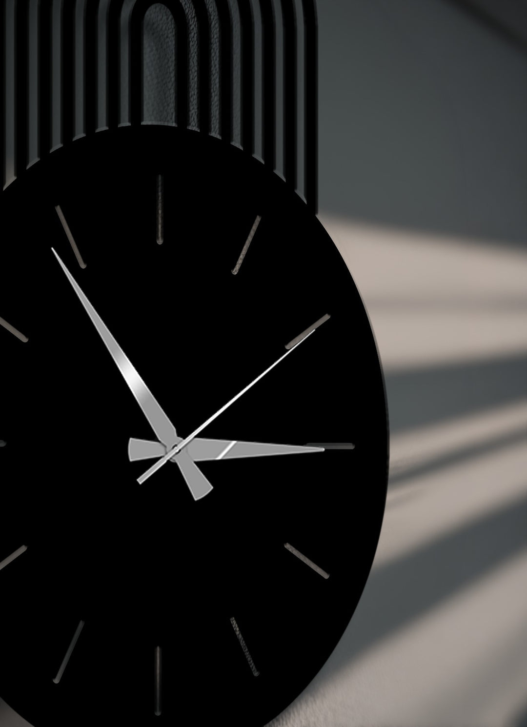 Predominantly black, this sleek modern arc metal artwork wall clock features reflective silver hands, creating a striking contrast against its dark face.