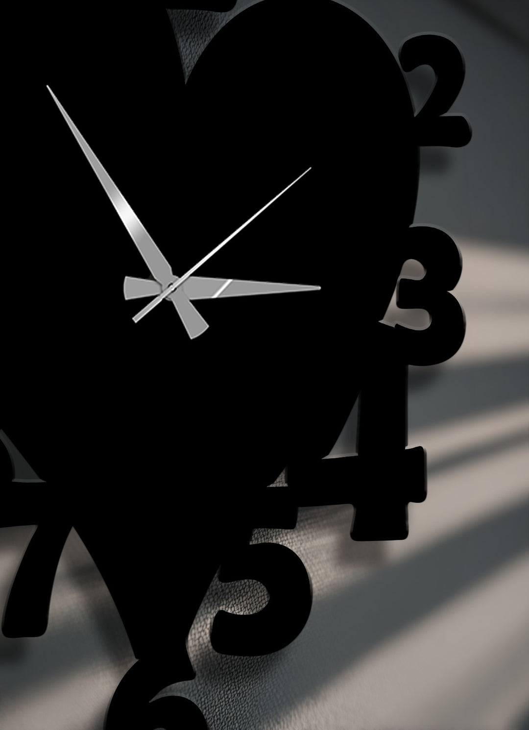 The distinct, raised edges and borders of this black heart shape number metal wall clock create a unique metal wall art piece with elegant shadows.