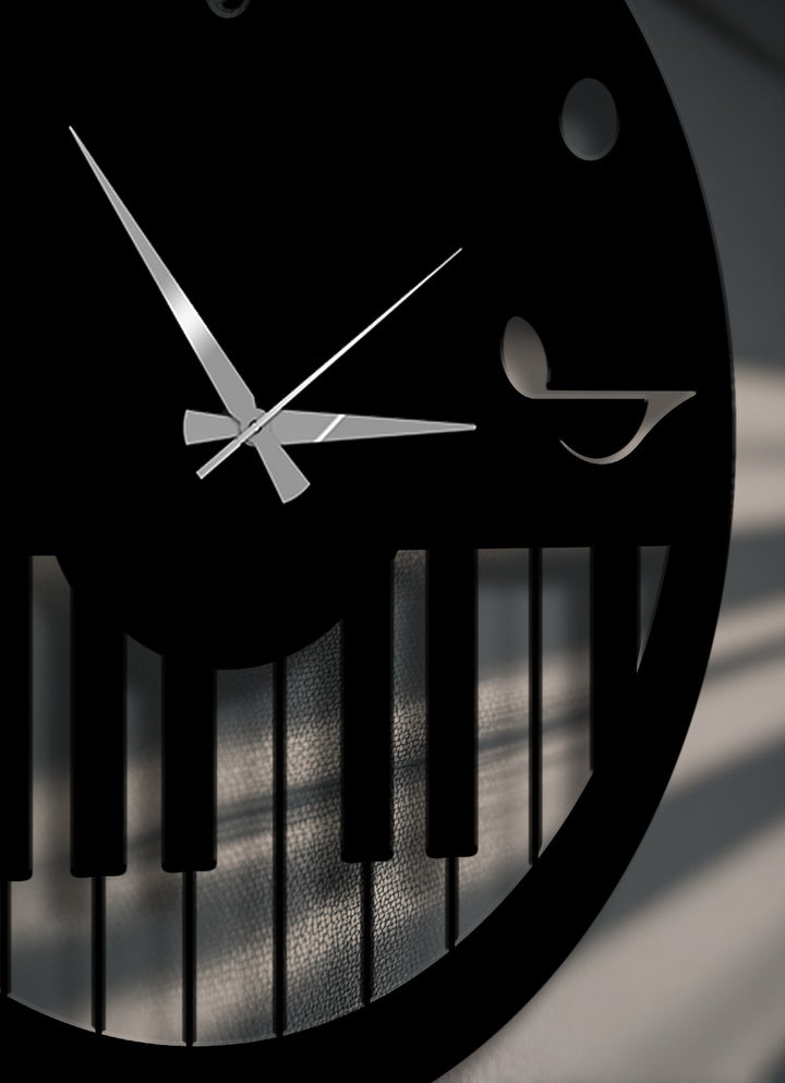 The foreground shows sleek silver hands and piano key design of this music theme metal wall clock, unique decoration wall art.