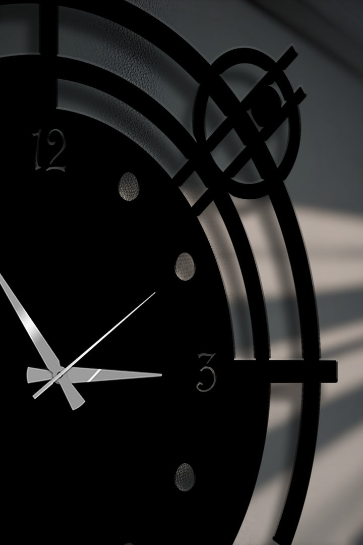 The matte black finish of this orbit geometric metal wall clock highlights its unique metal wall art design with precision cut details.