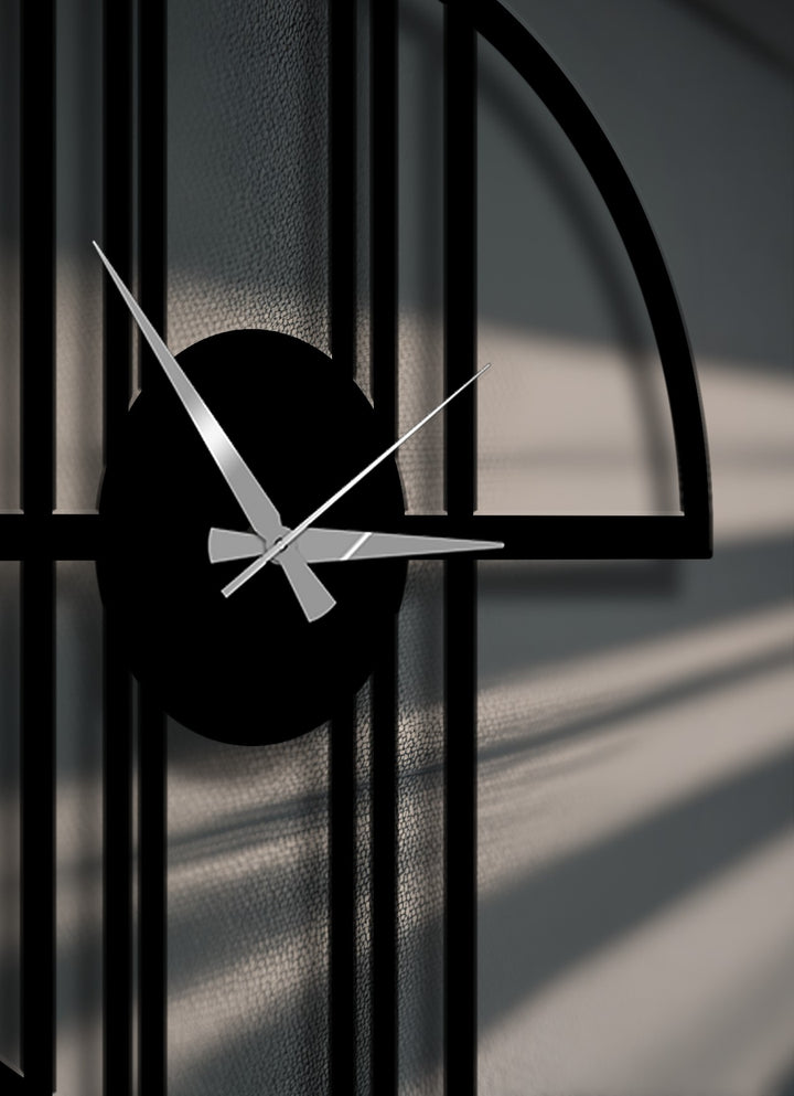 Sleek black and dark grey hues dominate this modern geometric frame metal wall decor clock with silver hands and soft shadows.