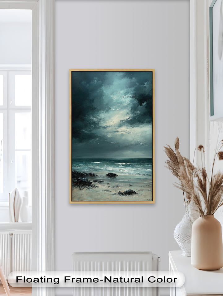 The contrast between the brooding sky and the soft movement of the sea creates a hauntingly beautiful coastal scene.
