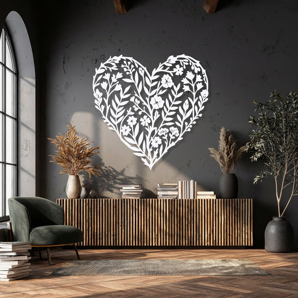 The crisp, detailed edges and borders of the white botanical floral heart silhouette reveal the artistic quality of this metal artwork.