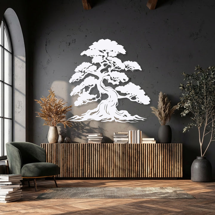 The subtly saturated image highlights a striking white Timeless Bonsai Spirit nature-inspired tree metal artwork against a dark wall.