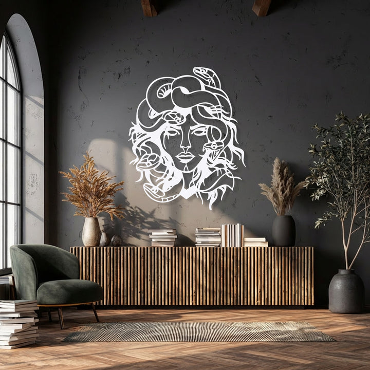 The prominent white Medusa metal wall art, a mythological snake goddess decoration wall art, commands attention on the dark textured wall.