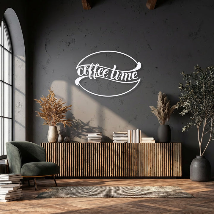 A deep emerald armchair, stacked books, and a striped rug on a wooden floor define the foreground, complemented by unique metal wall art.