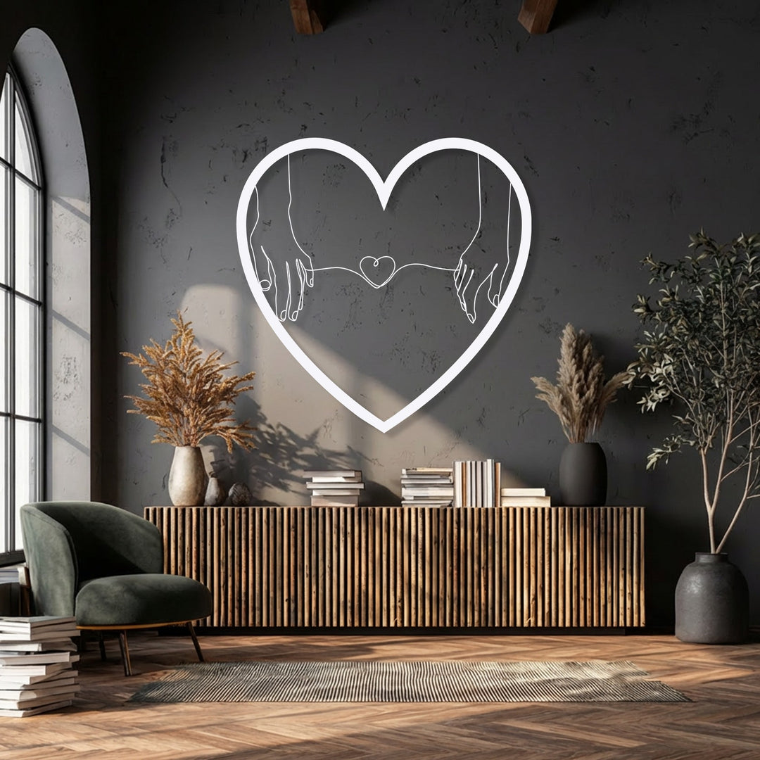 The soft, warm light enhances the minimalist heart hands metal wall art, creating a cozy ambiance for this romantic decoration wall art.