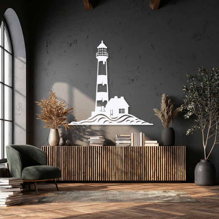 The dramatic color contrast of the luminous white coastal lighthouse metal wall decor against the deep charcoal wall creates a striking nautical focal point.