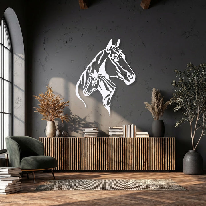 Against a dark charcoal grey wall, striking white Dual Horse Head Silhouette metal wall decor creates an elegant focal point.