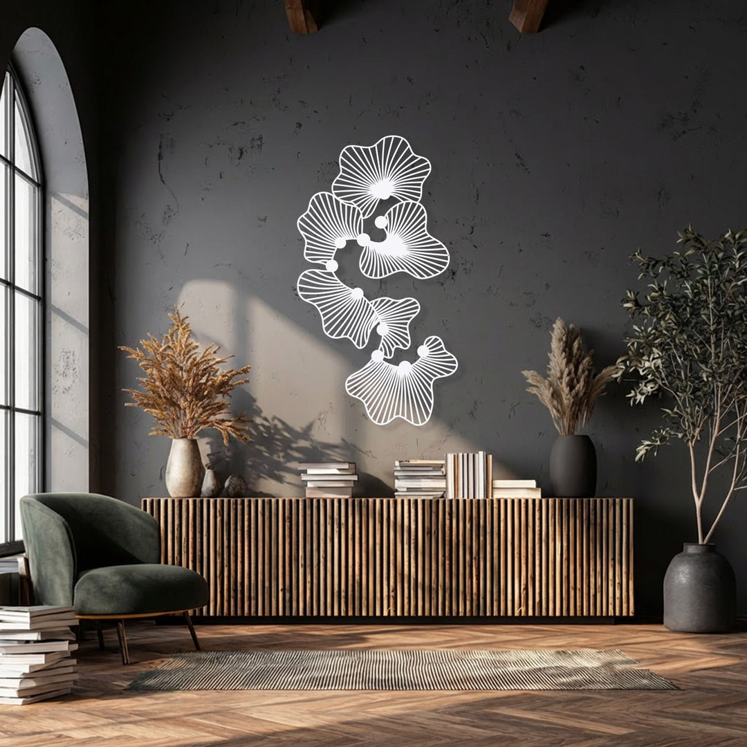 The abstract floral metal art gracefully ascends the wall, creating a dynamic flow that enhances this modern metal art for wall decor.