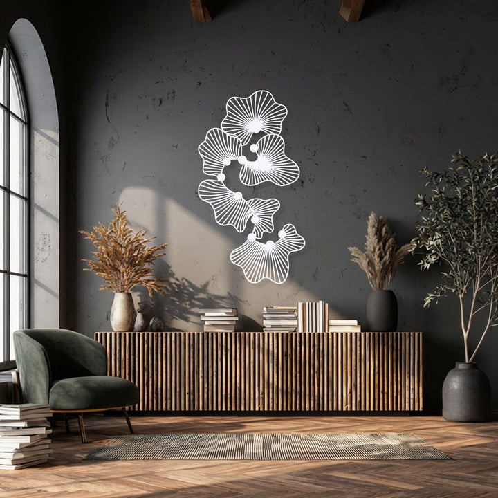 The abstract floral metal art gracefully ascends the wall, creating a dynamic flow that enhances this modern metal art for wall decor.