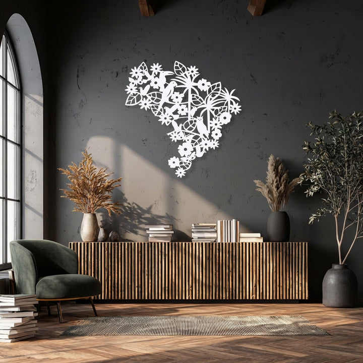 The muted color saturation highlights a striking white floral bird metal wall art piece above a wood console, creating a tranquil scene with decorative metal art.