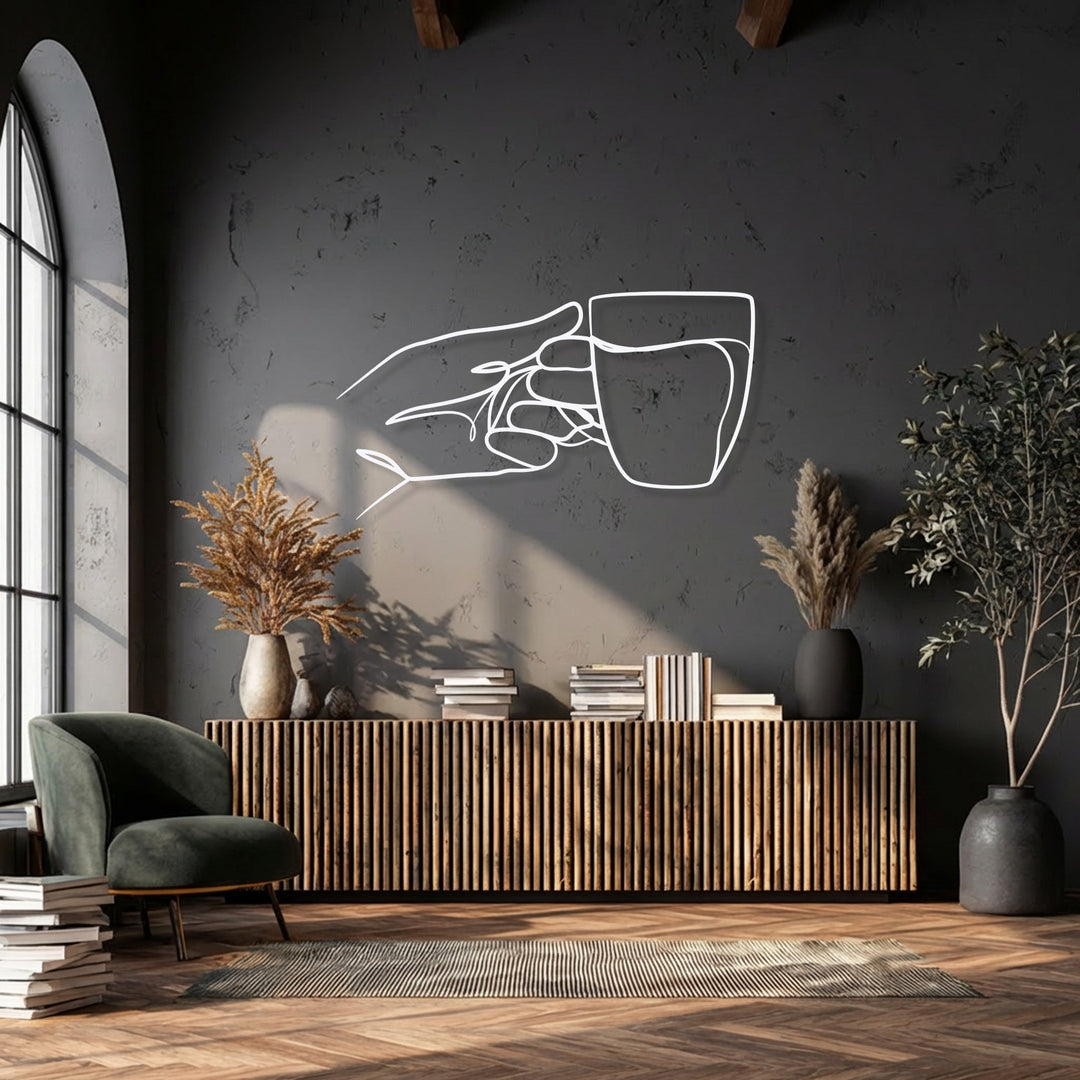 Low color saturation defines this striking metal artwork featuring a minimalist hand holding a cup against a deep, muted wall.