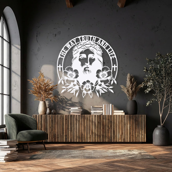 Dark charcoal walls provide a somber backdrop for the striking white metal wall decor of Sacred Jesus with 'The Way Truth and Life'.