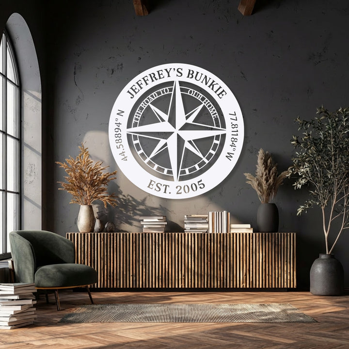 The simplified lines of the personalized compass decorative metal art create an abstract focal point with custom text and coordinates.