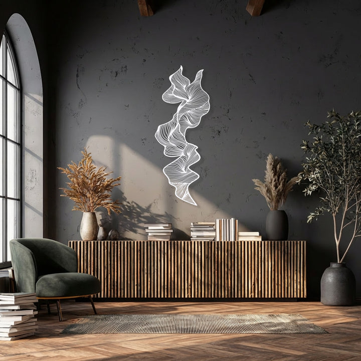 The stillness of this elegant space is highlighted by a captivating vertical abstract flow metal artwork, offering serene modern decor.