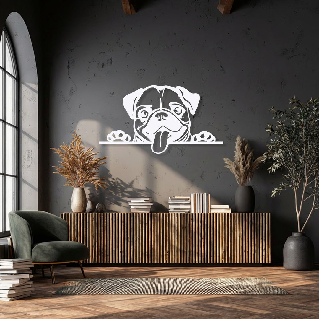 An abstract silhouette of a playful pug dog, a decorative metal art piece, peeks over a wooden cabinet against a textured dark gray wall.