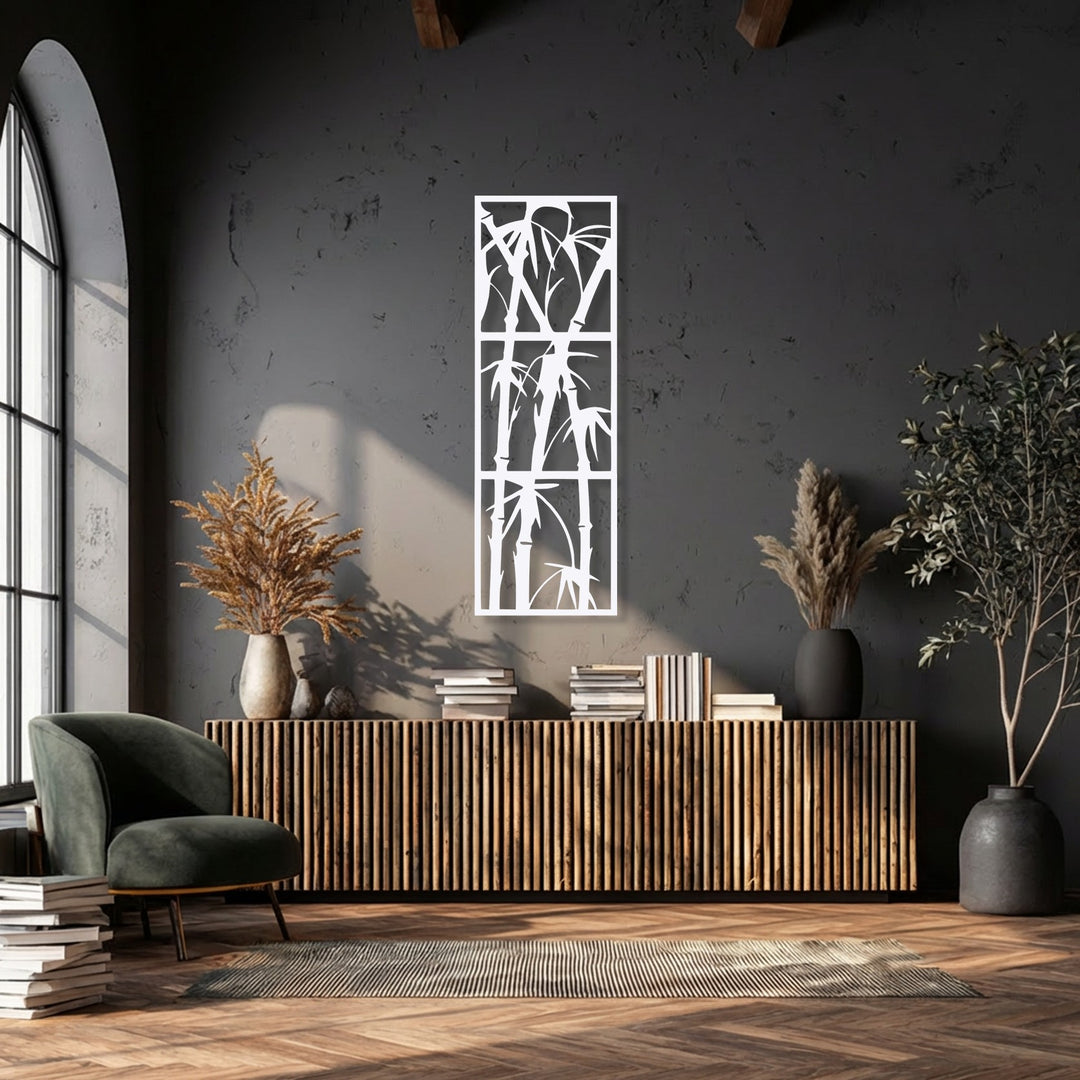 The negative space of this minimalist Zen bamboo decorative metal art reveals elegant, slender stalks and delicate leaves against a dark wall.