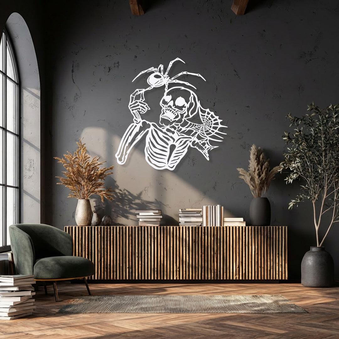 Cool color temperatures highlight the striking white Gothic skeleton and spider unique metal wall art against a dark gray wall.