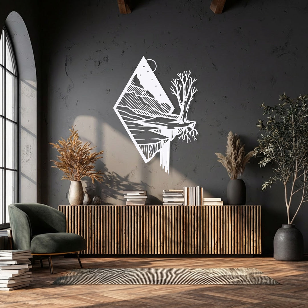 The desaturated image highlights a striking white floating mountain metal wall decor against a dark, textured wall, creating a minimalist contrast.