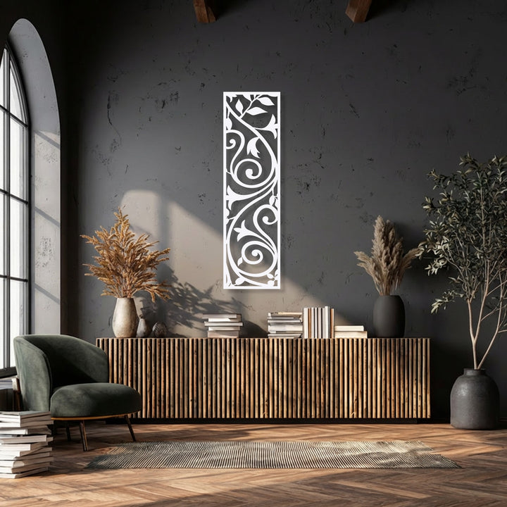 With subdued color saturation, an elegant vertical scroll vine metal wall decor piece brightens a dark, modern interior.