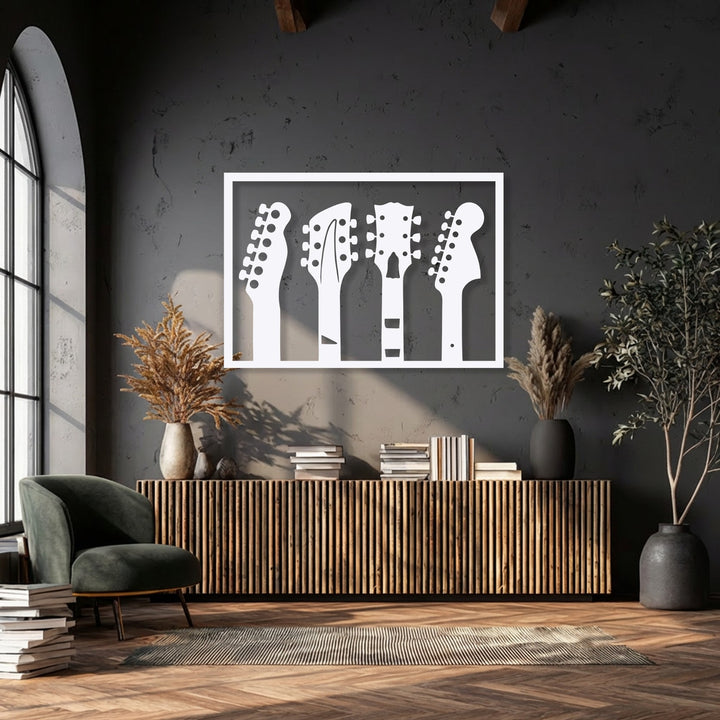 The layering effect is prominent in the white guitar headstock silhouettes of this music-inspired metal wall decor, contrasting against a dark wall.