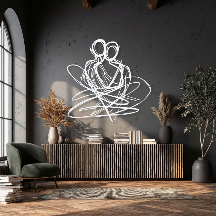 The balanced color temperature of this room, featuring warm sunlit wood and cool dark walls, highlights the abstract couple metal decoration wall art beautifully.