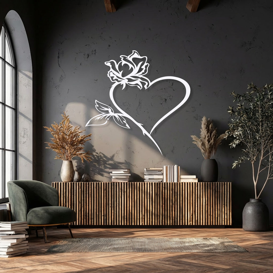 Emphasizing the flowing, natural curves of the rose and heart, this decorative metal art piece brings organic elegance to the dark wall.