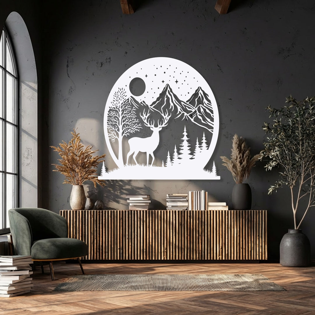 A striking circular metal wall decor piece featuring geometric cutouts of a majestic deer, towering mountains, a full moon, and numerous stars.