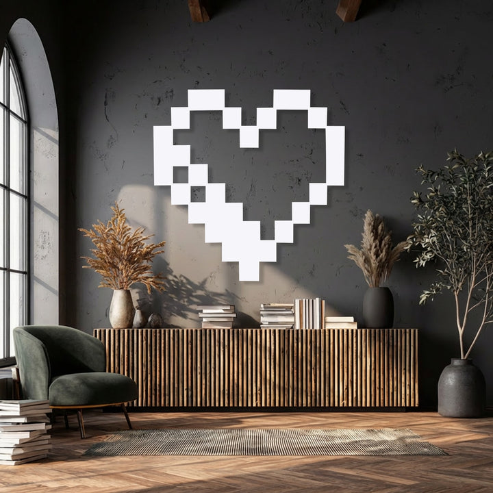 Centrally oriented metal wall decor showcases a distinctive hollow pixelated heart shape, perfect for retro gaming enthusiasts.