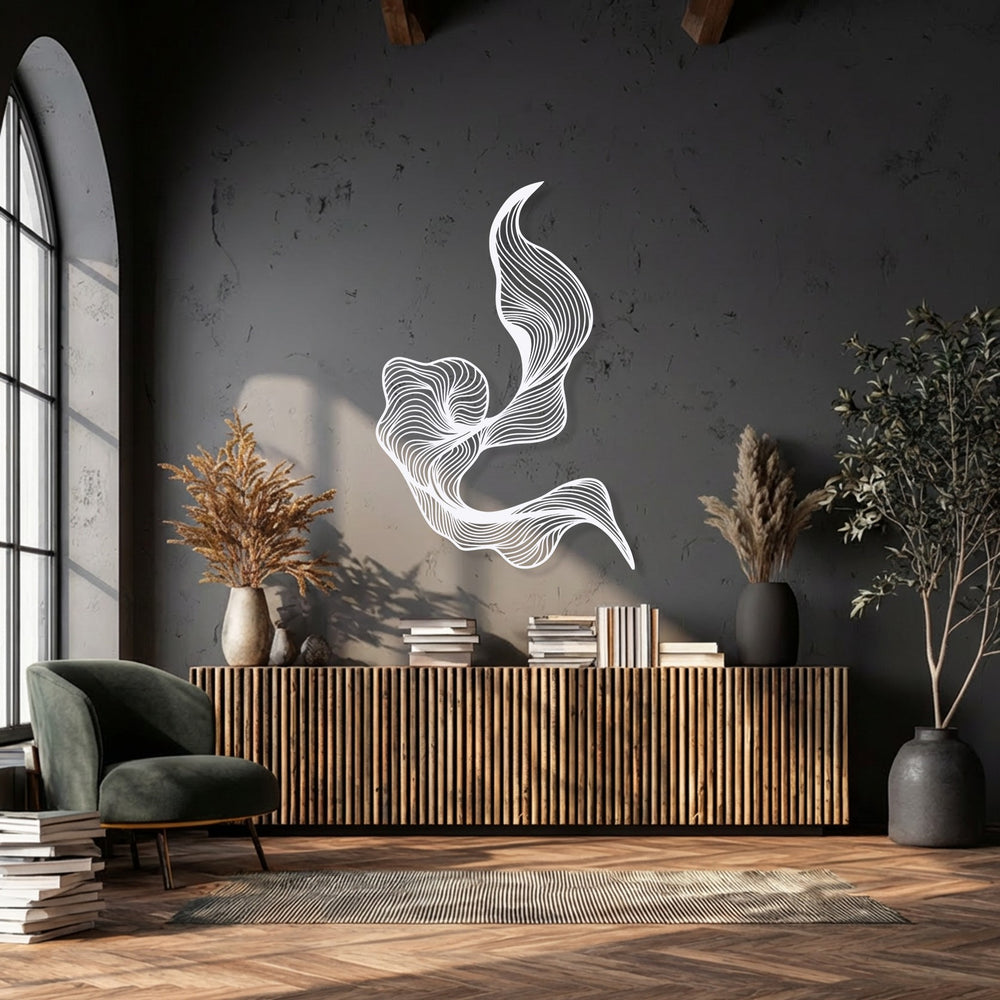 The brightest area highlights a radiant white unique metal wall art featuring an abstract fluid line design on a dark, textured wall.