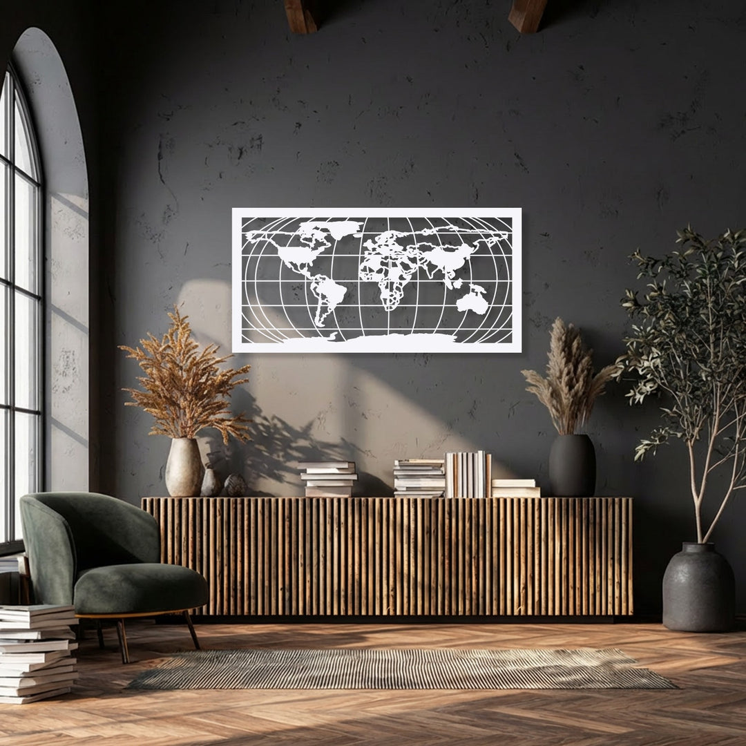 A plush dark green armchair, stacks of books, and a striped rug lie in the foreground, framing the modern world map unique metal wall art.