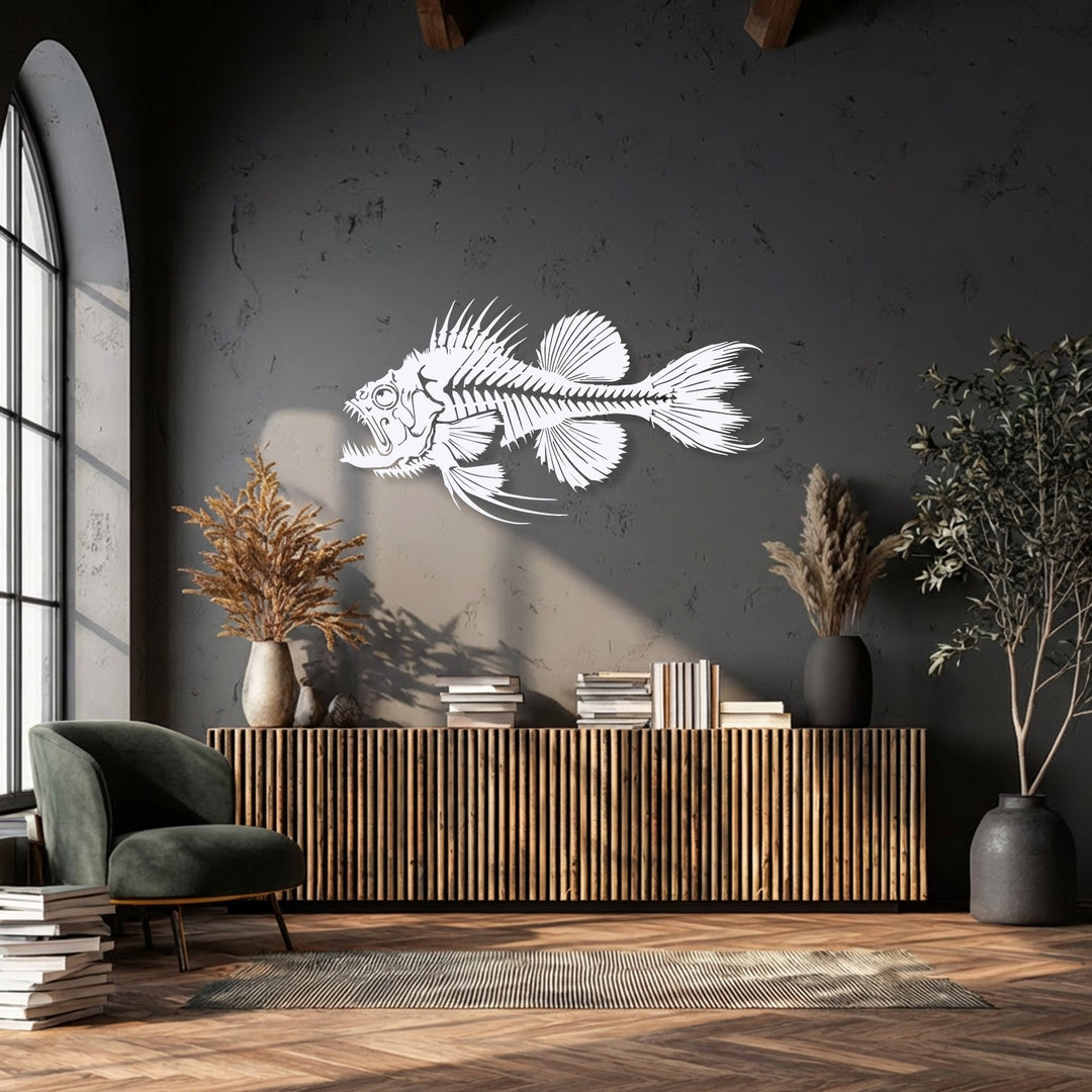 The organic forms of a predator fish skeleton decorative metal art piece dominate a textured wall, flanked by natural dried and live plants.
