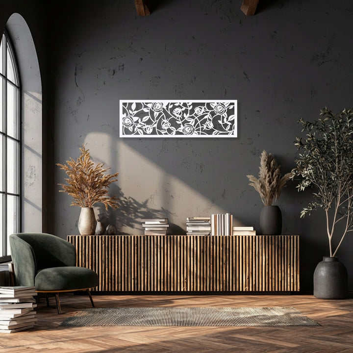 Sunlight casts dynamic light and shadow patterns over the elegant floral vine metal art for wall, showcasing its rose garden design.