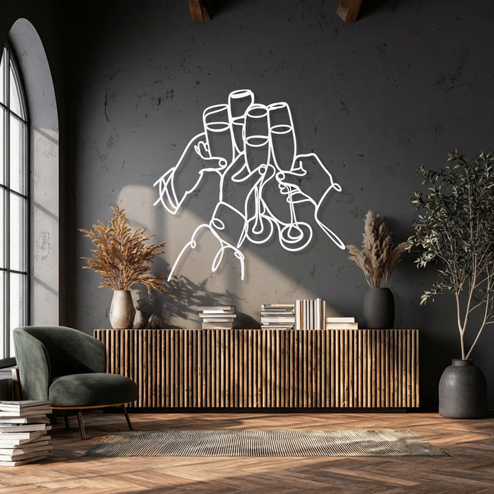 The central subject is a modern white line art metal decoration wall art showing hands clinking champagne glasses in celebration.
