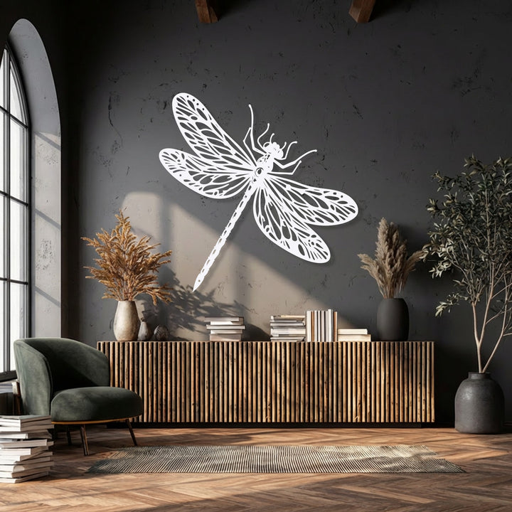 The deep charcoal wall highlights an elegant white dragonfly unique metal wall art, enhancing its nature-inspired details beautifully.