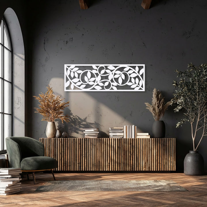 Abstractly, the modern metal wall decor features a flowing botanical vine and leaf pattern, creating an elegant, nature-inspired aesthetic.
