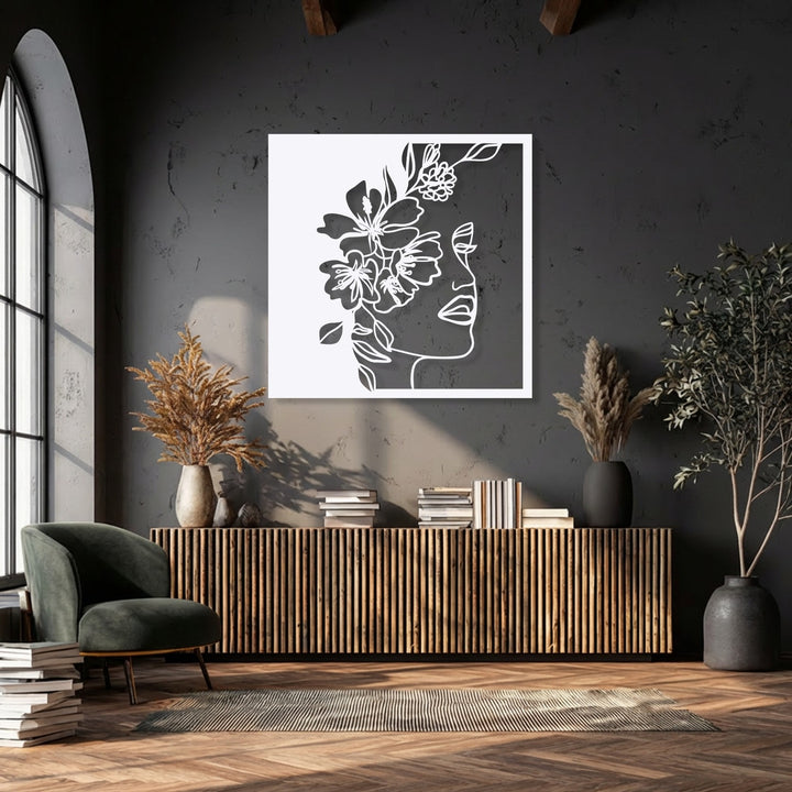 Organic forms intertwine in this ethereal Floral Woman Line Art metal wall decor, a delicate silhouette adorned with blossoms.