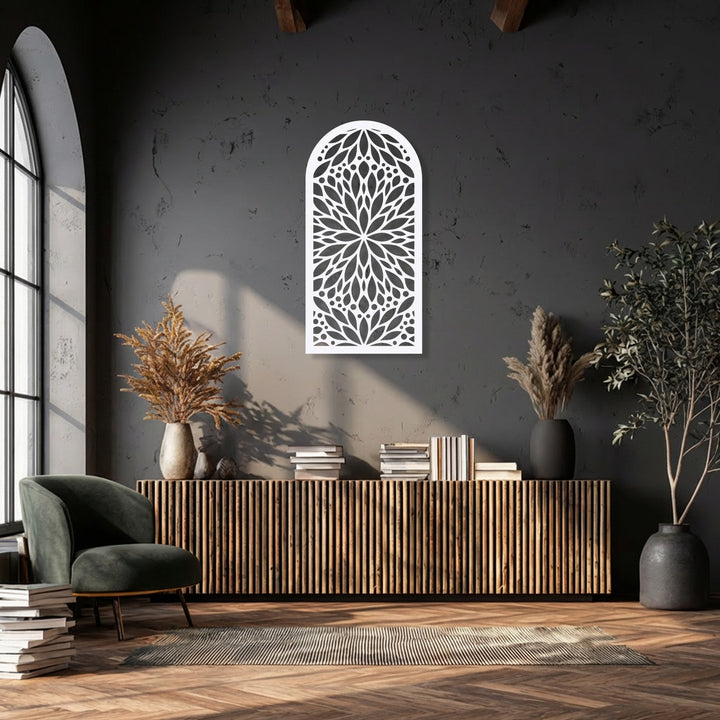 The distressed concrete wall and smooth, intricate cut-outs of the mandala floral decoration wall art create a rich surface texture.