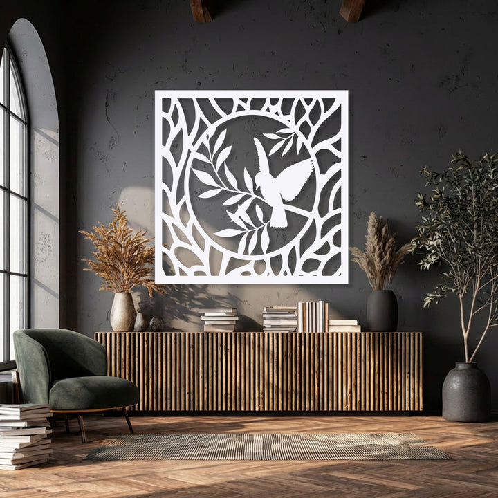 The geometric rectangular frame and central circular design of this unique metal wall art showcase a bird perched on intricate branches.